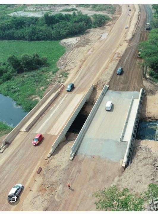 Aerial view of bridge and road construction works by PEEKOB in Ghana